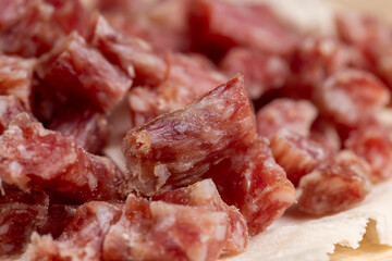 Obraz premium Thinly sliced dried meat sausage