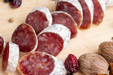 Chunks of sliced sausage with white mold