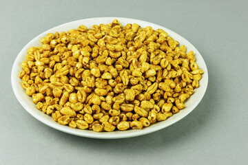 Dry breakfast wheat flakes on a plate
