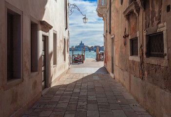 Traditional Venetian houses along the canal on a sunny day.