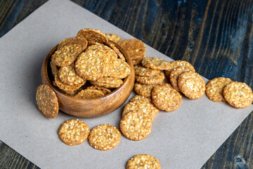 oatmeal thin round cookies with lots of sesame seeds