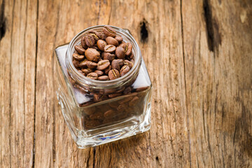 Roasted coffee beans in container, Colombian coffee