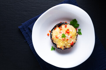 Healthy food concept bake Cheese Stuffed Mushrooms on black background with copy space