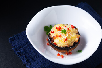 Healthy food concept bake Cheese Stuffed Mushrooms on black background with copy space