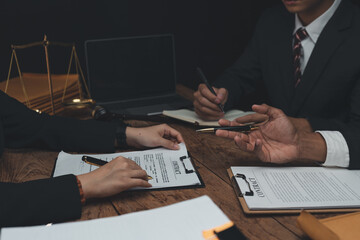 Lawyer and client sign variou financial legal contract to mediate with the legal execution...