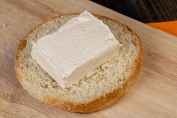 Wheat bun with large pieces of processed cheese inside