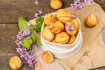 Cookies in the shape of walnuts with condensed milk cream filling.Delicious shortbread sandwiches