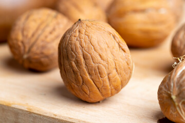 Unpeeled walnut harvest on the table