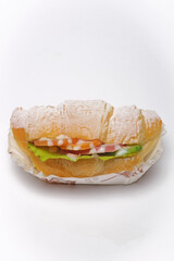 Stuffed croissant on a white background