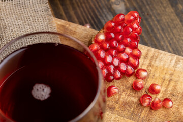 Sweet and sour pomegranate juice in a transparent glass