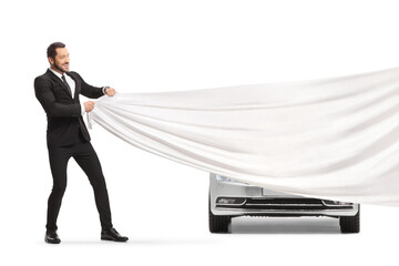 Businessman pulling a white piece of cloth in front of a new car