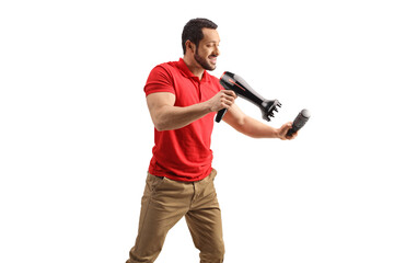 Man working with a hair dryer and a brush