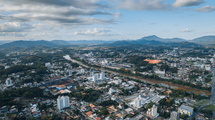 aerial image of downtown Blumenau, with Itajaí Açú River, Santa Catarina, southern Brazil, buildings, main streets, vegetation and sunny day