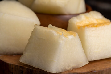 Ripe yellow melon cut into pieces and portions