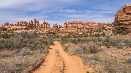 hiking the chesler park loop trail in the needles in canyonlands national park, usa