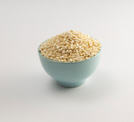 Bowl full of puffed brown rice