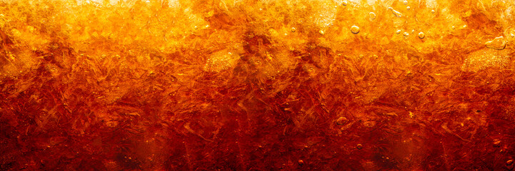 macro cola drink background,Close up view of ice cubes in dark cola background. Surface of sweet summer cold drink with foam and macro bubbles on glass wall. Fizzing or float to the top of the surface - obrazy, fototapety, plakaty