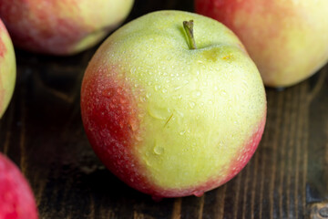 Fresh red and green apples on the kitchen table