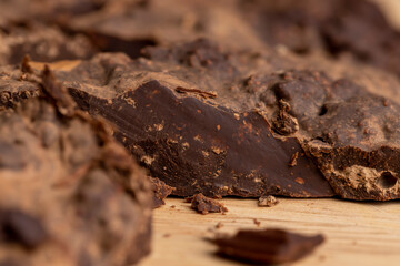 Pieces of chocolate with added cocoa and sugar