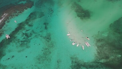 Aerial view of boats anchored in tuquoise water in Sting Ray City in Cayman Islands