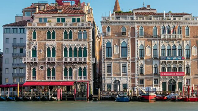 Palazzo Giustinian on the Grand Canal timelapse front view, Venice, Italy. Early morning after sunrise. Gondolas staying near by