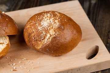Wheat bun with large pieces of processed cheese inside