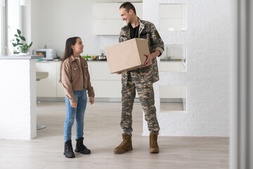 Soldier Holding Shipping Box. military man with a box