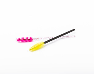 Mascara brushes, makeup brushes, applicators isolated on white background. Close-up. Brushes for eyelash extensions.