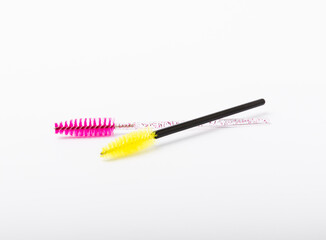 Mascara brushes, makeup brushes, applicators isolated on white background. Close-up. Brushes for eyelash extensions.