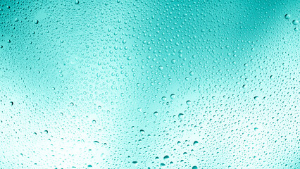 Glowing gradient turquoise background with contrasting water drops