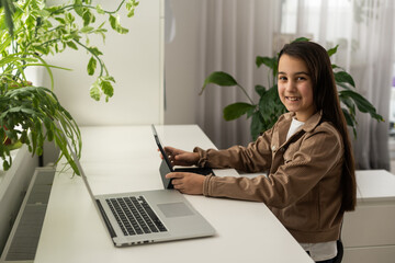 Smiling girl on videocall with guy, making video call to close foreign friend, talking by web camera, using virtual chat app online, long distance relationships, focus on screen, close up rear view.