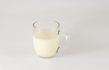 glass of milk on white