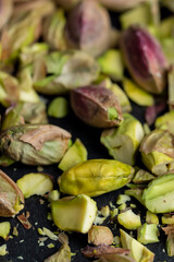 Crispy delicious pistachios with salt on the table