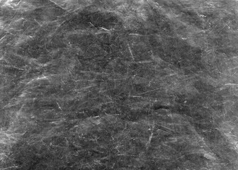White scratches and dust on black background. Vintage scratched grunge plastic broken screen texture. Scratched glass surface wallpaper. Space for text.