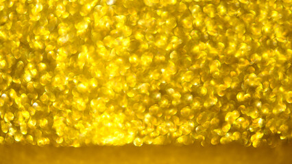  abstract gold glitter texture background. macro of sparkling shiny bokeh, defocused background, copy space