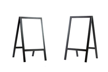 Floor flipcharts with black legs with screens isolated on white facing each other. Training, presentations and business meetings. Vertical. Space for text.