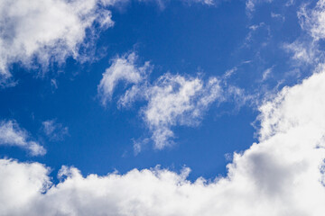 of a clear blue sky with white clouds.