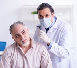 Male patient visiting doctor otolaryngologist