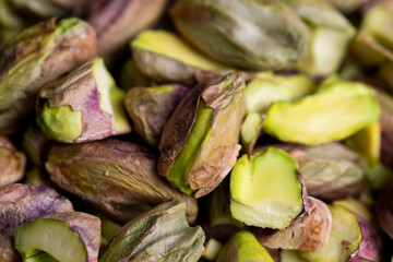 Crispy delicious pistachios with salt on the table