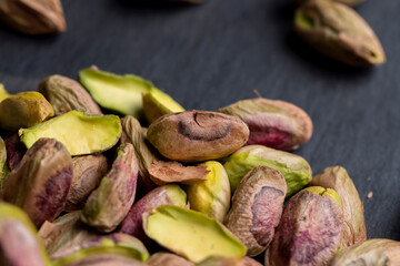 Crispy delicious pistachios with salt on the table