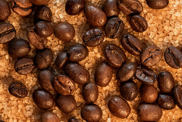 Coffee beans on brown sugar cane, background picture in brown tones