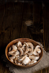Peeled, washed and cut mushrooms champignons during cooking