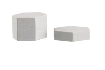 geometric figures made of wood, painted and stacked on a table, isolated