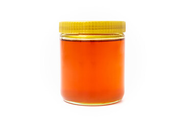 Jar of honey isolated on a white background
