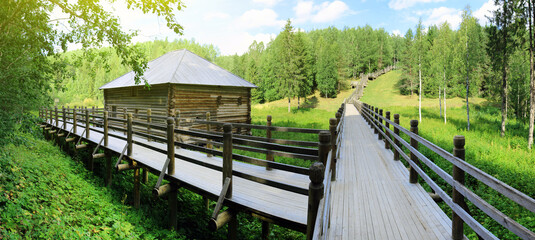 Wooden bridge buildings 19th century in the museum of wooden architecture "Small Korely". Russia, Arkhangelsk region