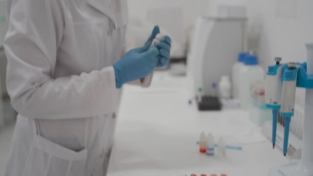 Center for lifeblood donation. Blood transfusion clinic. Plasma donation. Blood type and rh factor testing by agglutination method. Plastic blood palette in process HIV testing by agglutination method