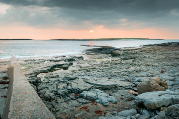 Fototapeta na wymiar Beautiful stunning sunset over atlantic coast in Inismore island far point in Ireland