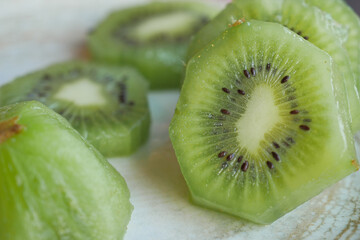 Fototapeta na wymiar Ripe half kiwi fruit on a plate 
