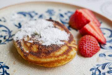 Pancakes with fresh berries on a plate 