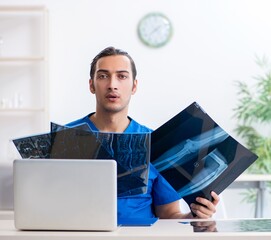 Young male doctor working in the clinic